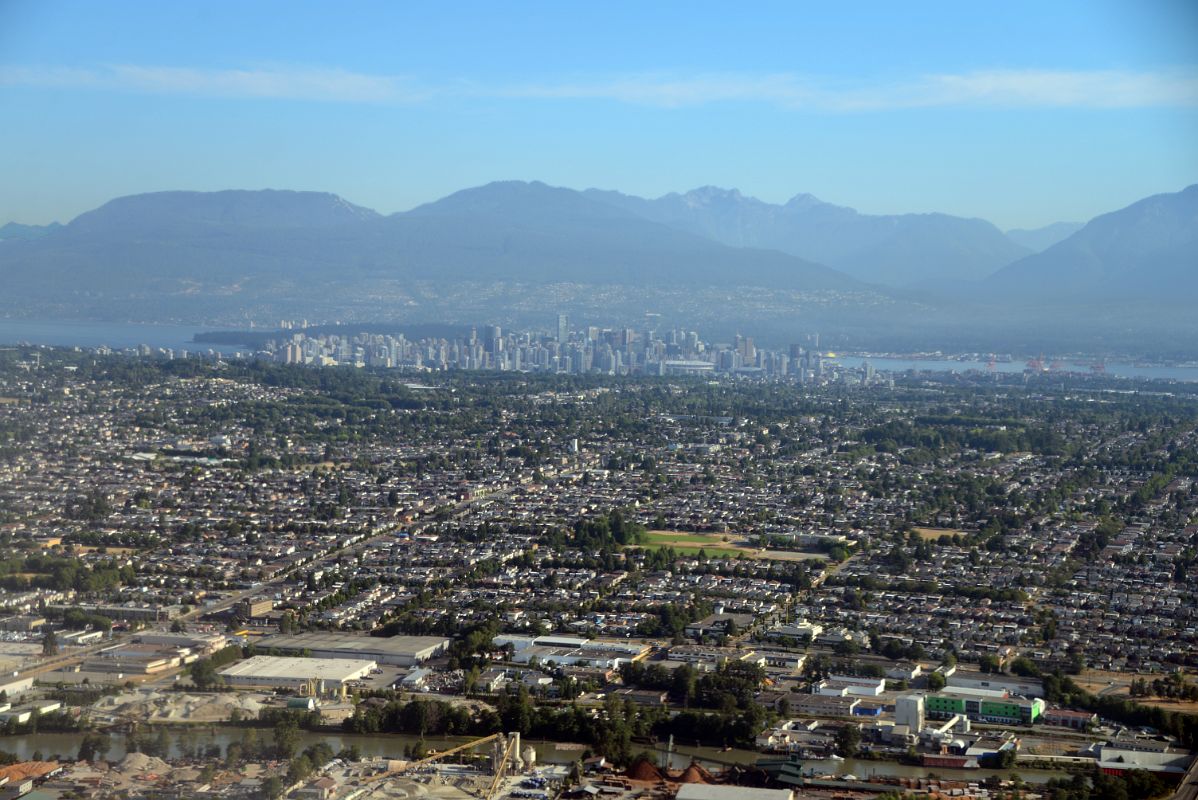 03 Vancouver Stretches To Downtown And Mountains Beyond From Airplane